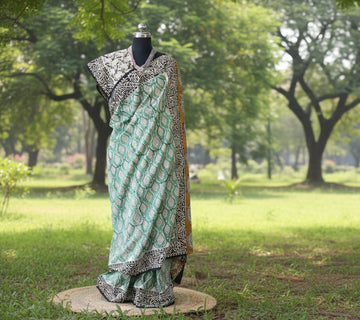 Mulmul cotton Saree with blouse –  This saree is rewashed for softness and organically dyed. Light weight easy to drape. Comfortable all day .